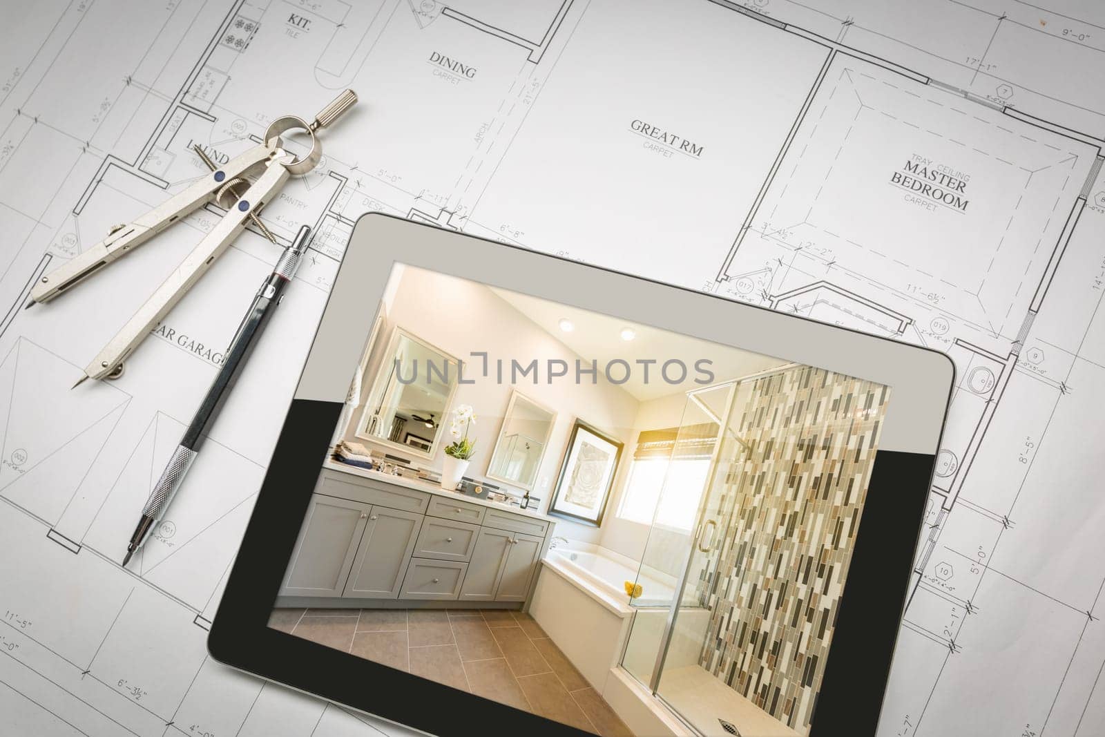 Computer Tablet with Master Bathroom Design Over House Plans, Pencil and Compass.