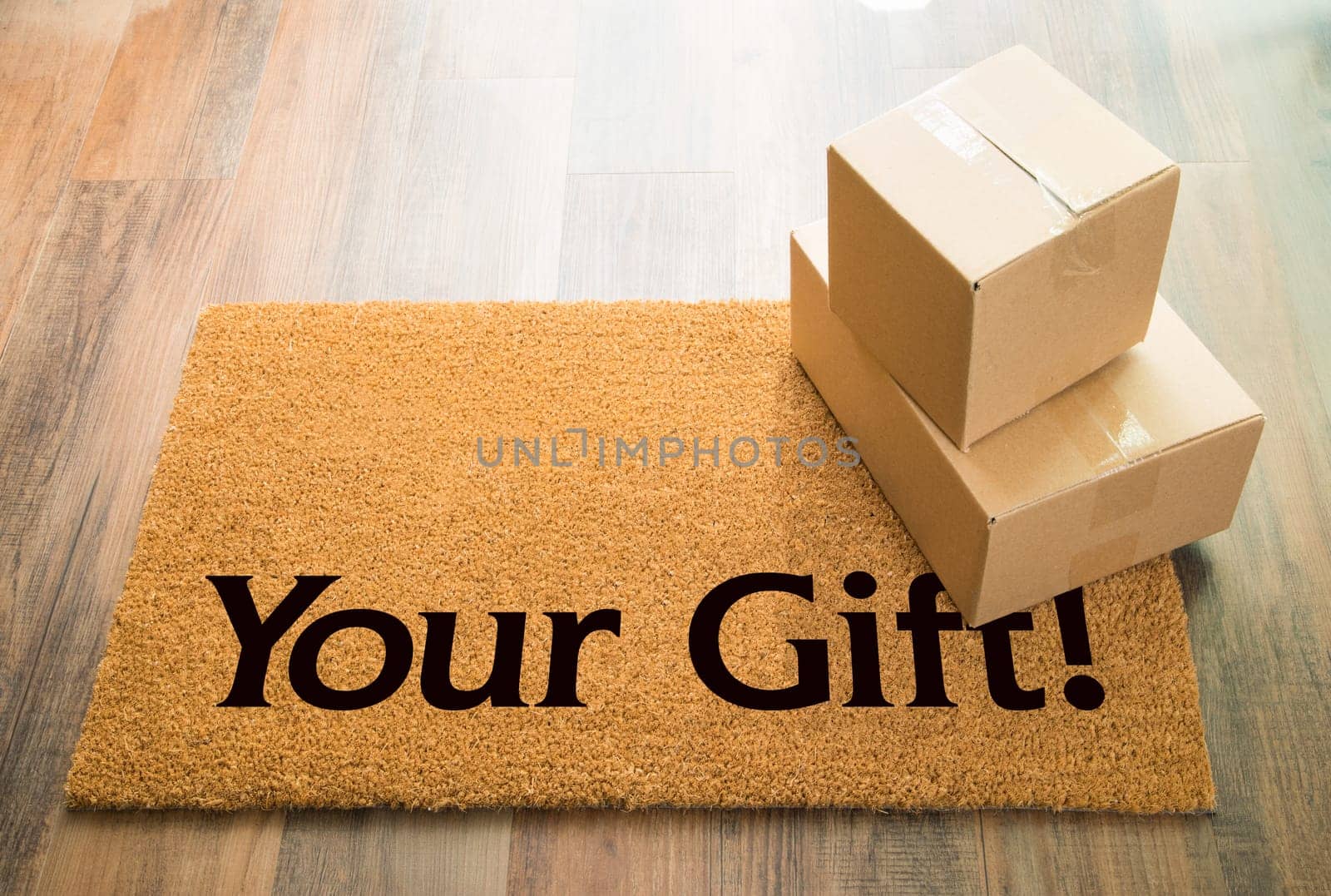 Your Gift Welcome Mat On Wood Floor With Shipment of Boxes.