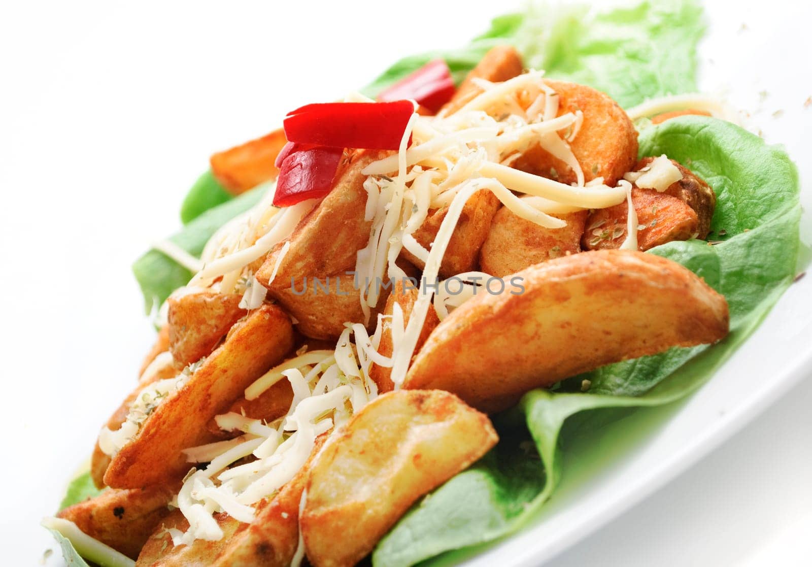 plate of decorative country potatoes with cheese