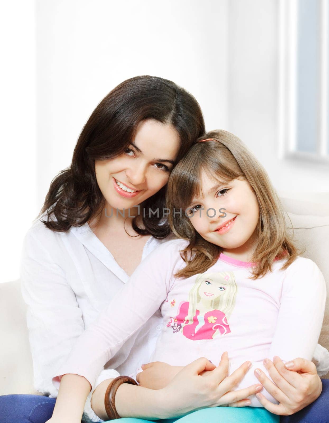 Portrait of happy mother and her smiling daughter