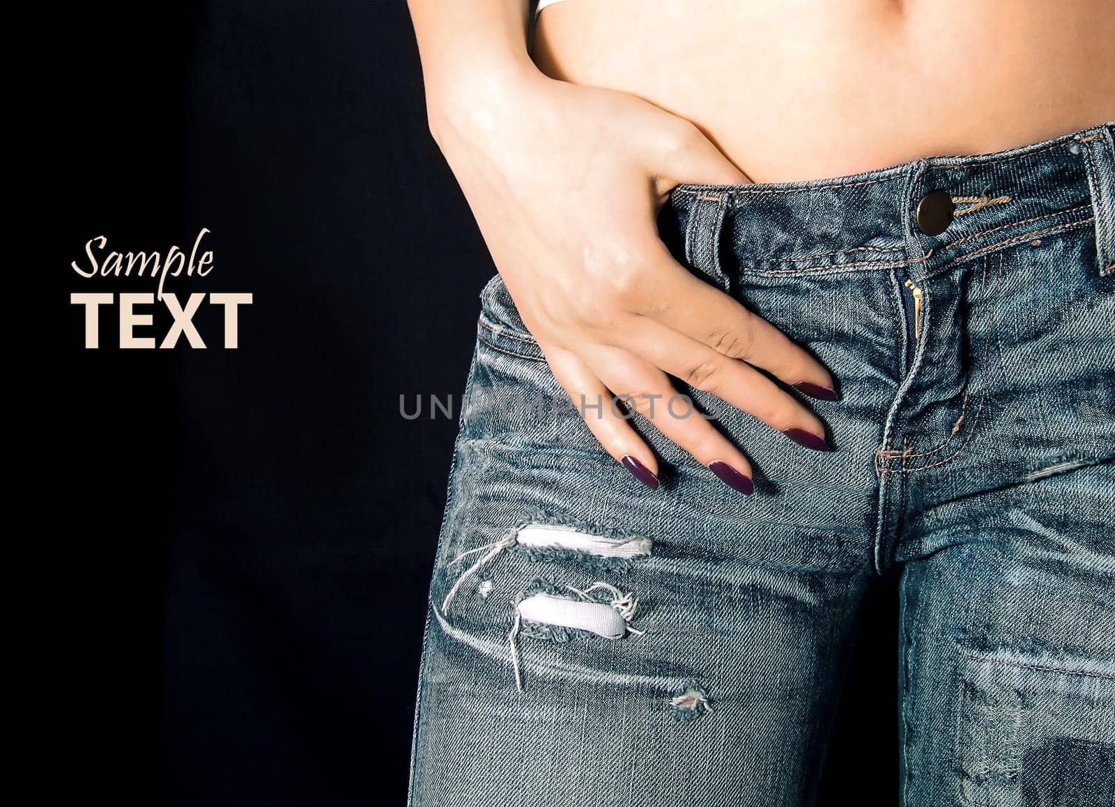 girl in jeans with hand over strap