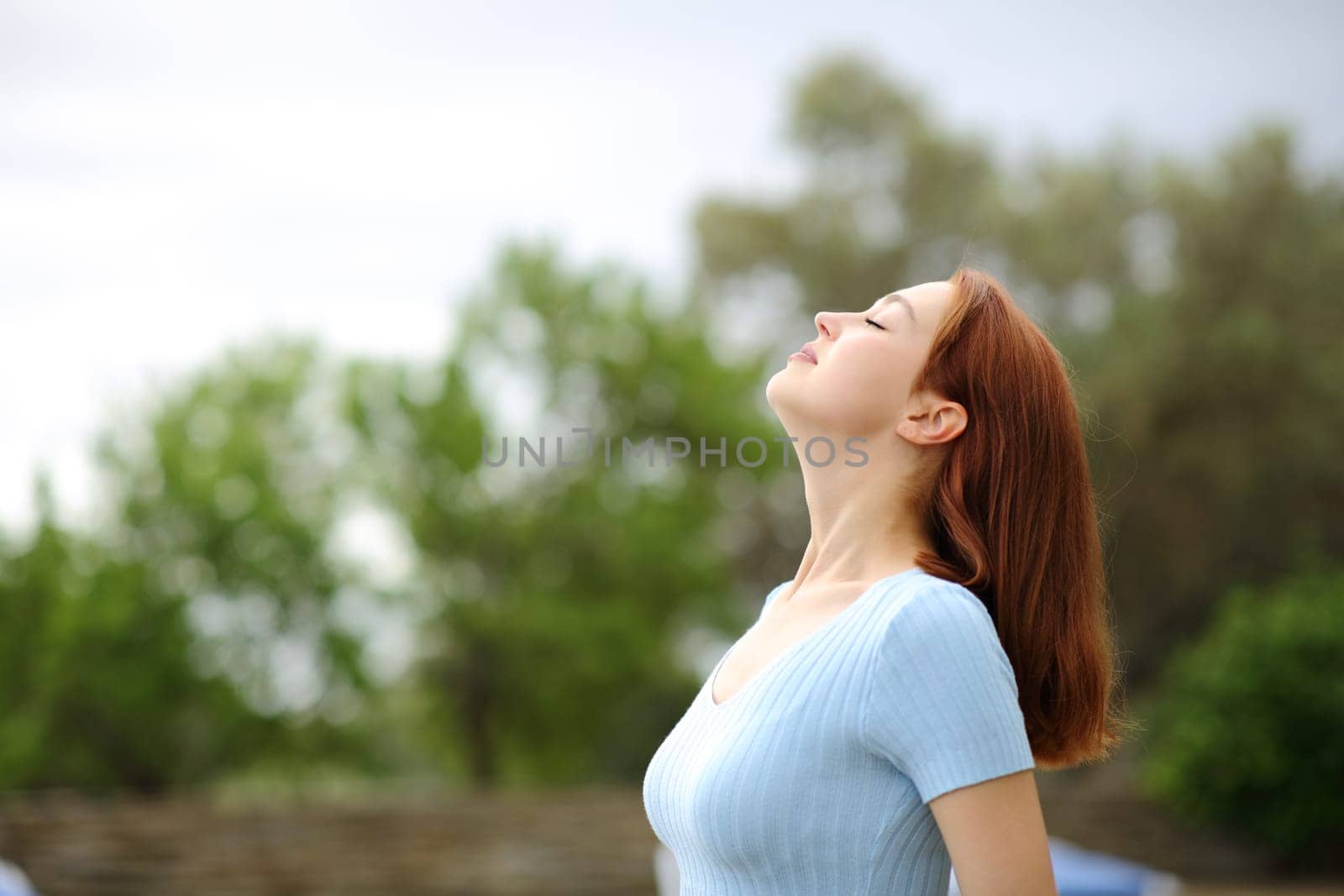 Woman breathing fresh air in a garden