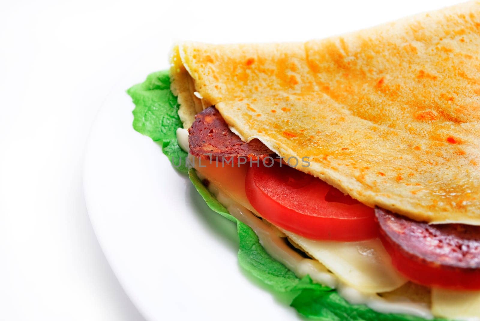 Decorative salty pancake in white plate