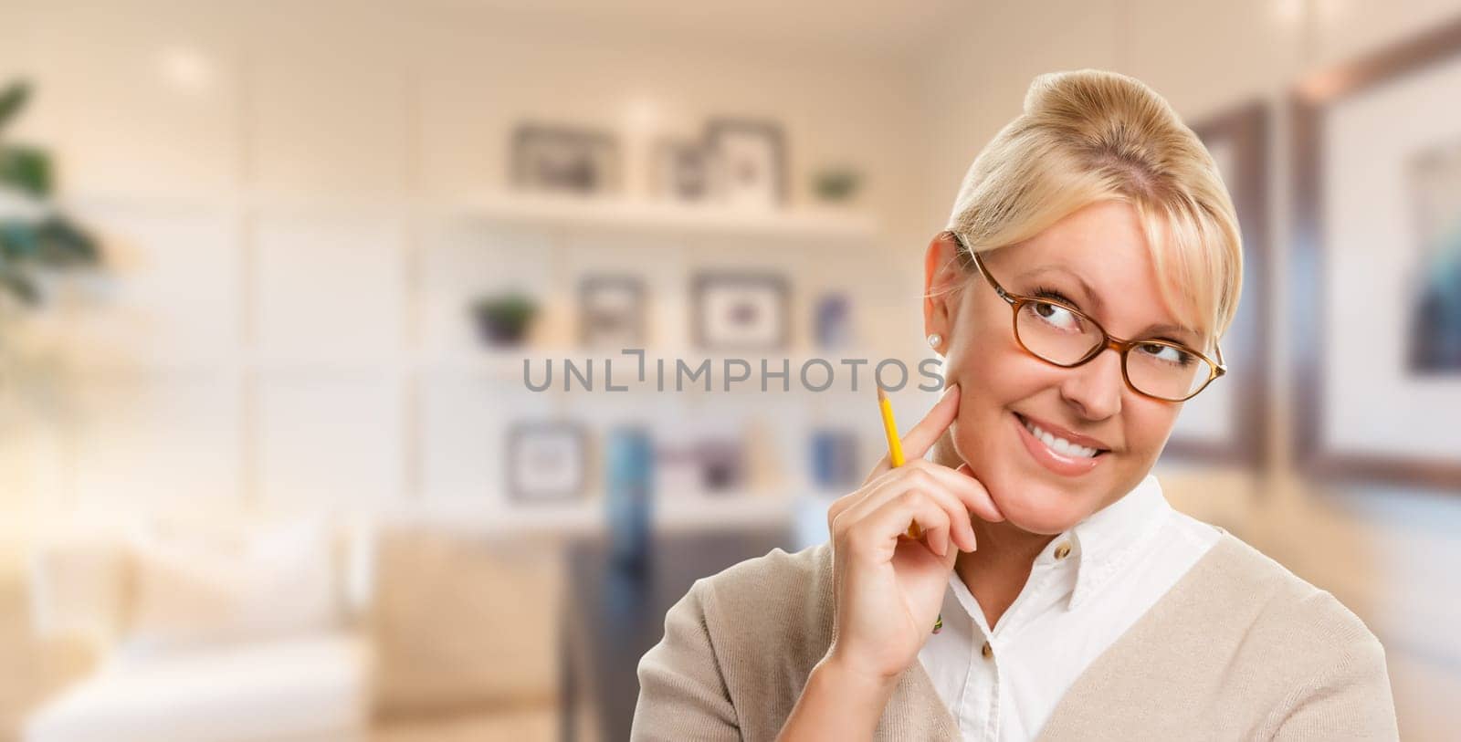 Beautiful Expressive Student or Businesswoman with Pencil in Office.