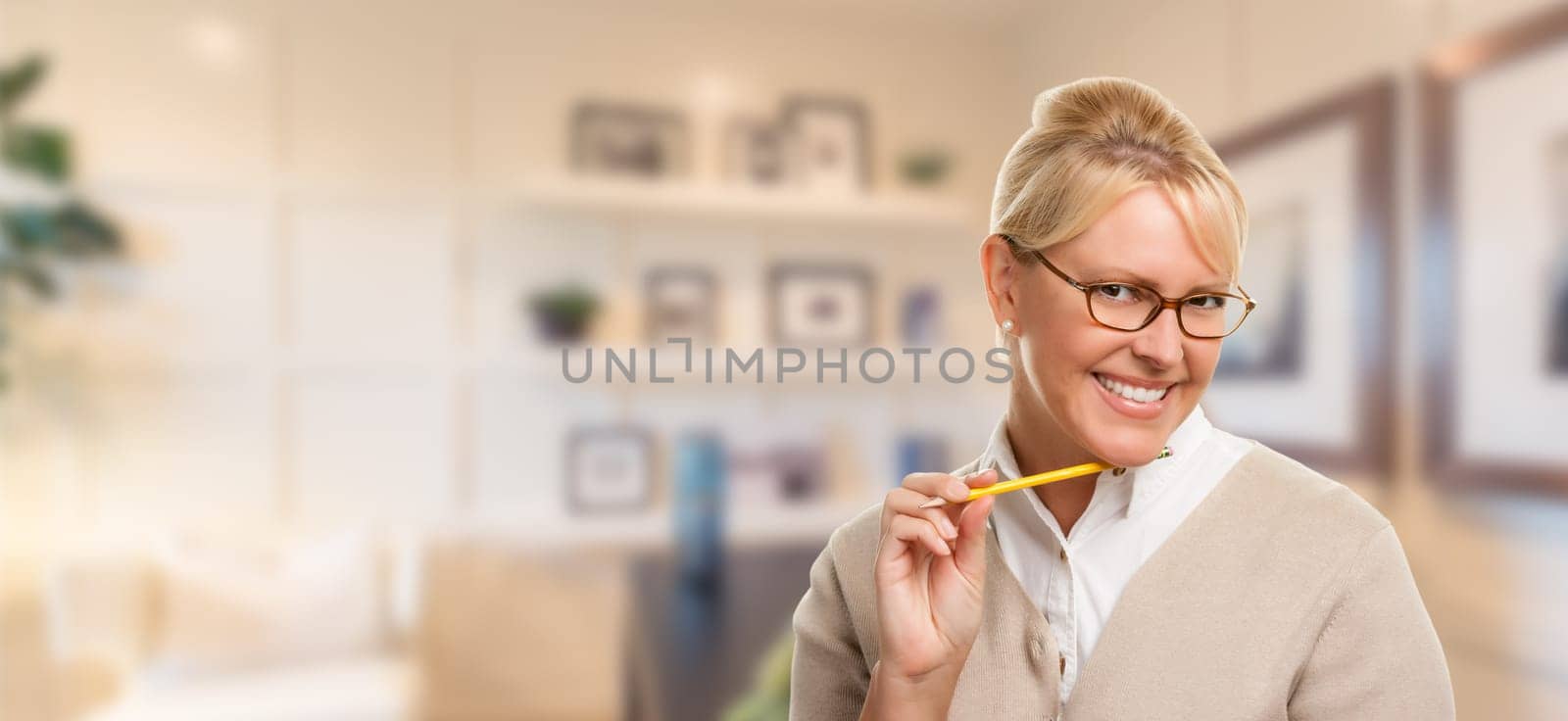 Beautiful Expressive Student or Businesswoman with Pencil in Office.