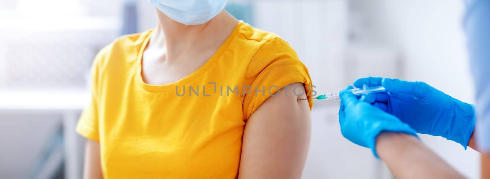 Nurse giving vaccine syringe against Covid 19 to patient. Concept immunization and vaccinating from pandemic of SARS.