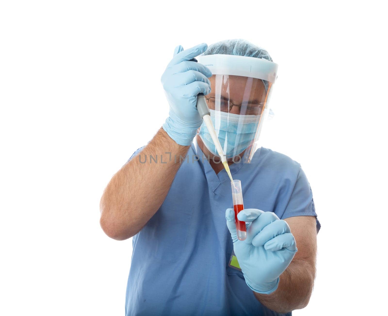 Healthcare professional pipetting a patient sample