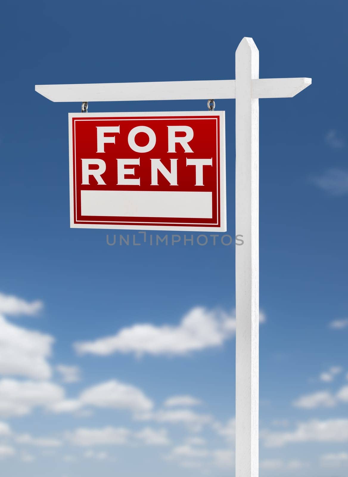 Left Facing For Rent Real Estate Sign on a Blue Sky with Clouds.