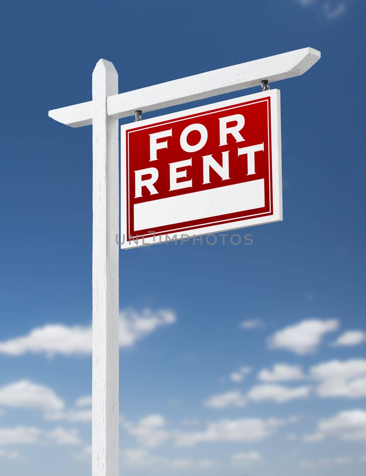 Right Facing For Rent Real Estate Sign on a Blue Sky with Clouds.