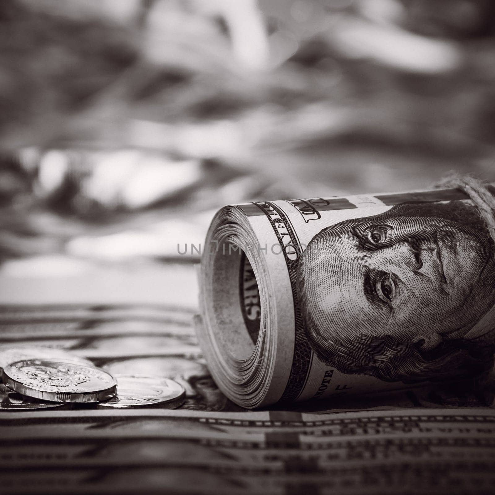 Stacks of coins against the background of hundred-dollar bills are scattered throughout the space. The coins are collected in two columns. The style is black and white.