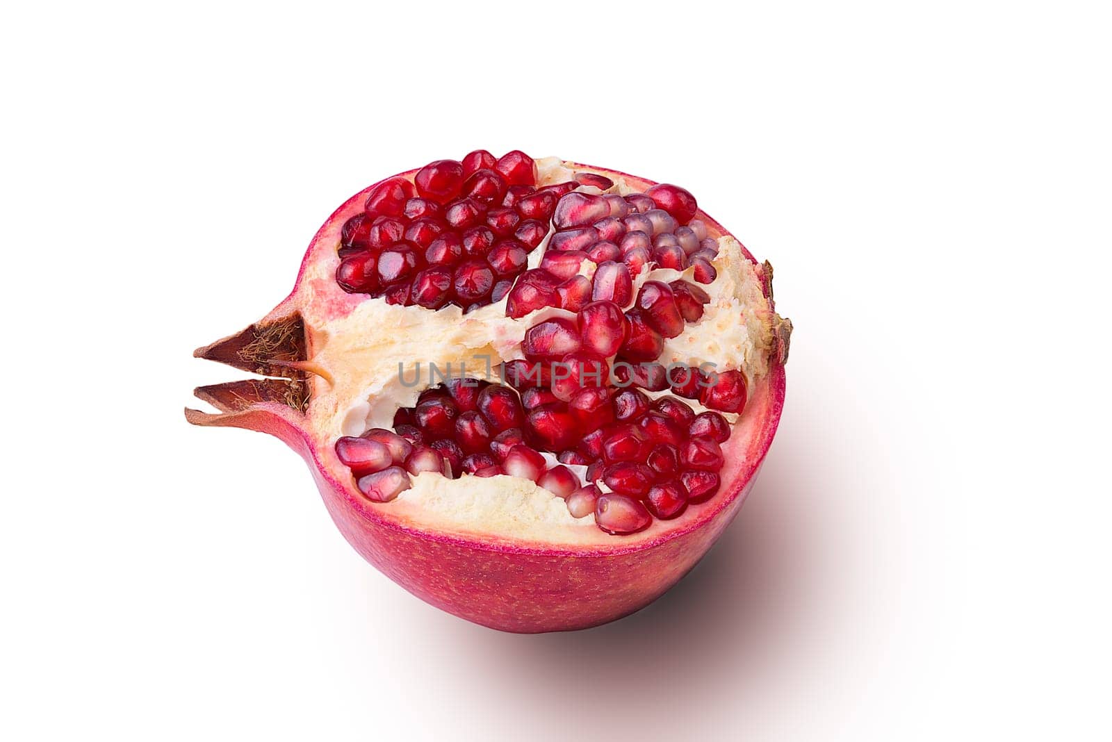Garnet isolated part on a white background close-up with shadow. Fresh pomegranate. Juicy pomegranate. Delicious pomegranate. Place for advertising, logo, lettering, layout, mockup.
