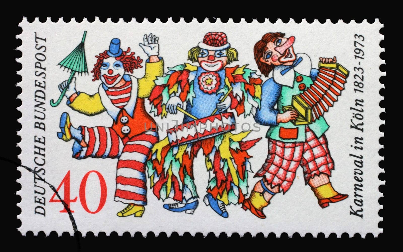 A stamp printed in Germany issued for the 150th anniversary of Cologne Carnival shows three clowns, circa 1972