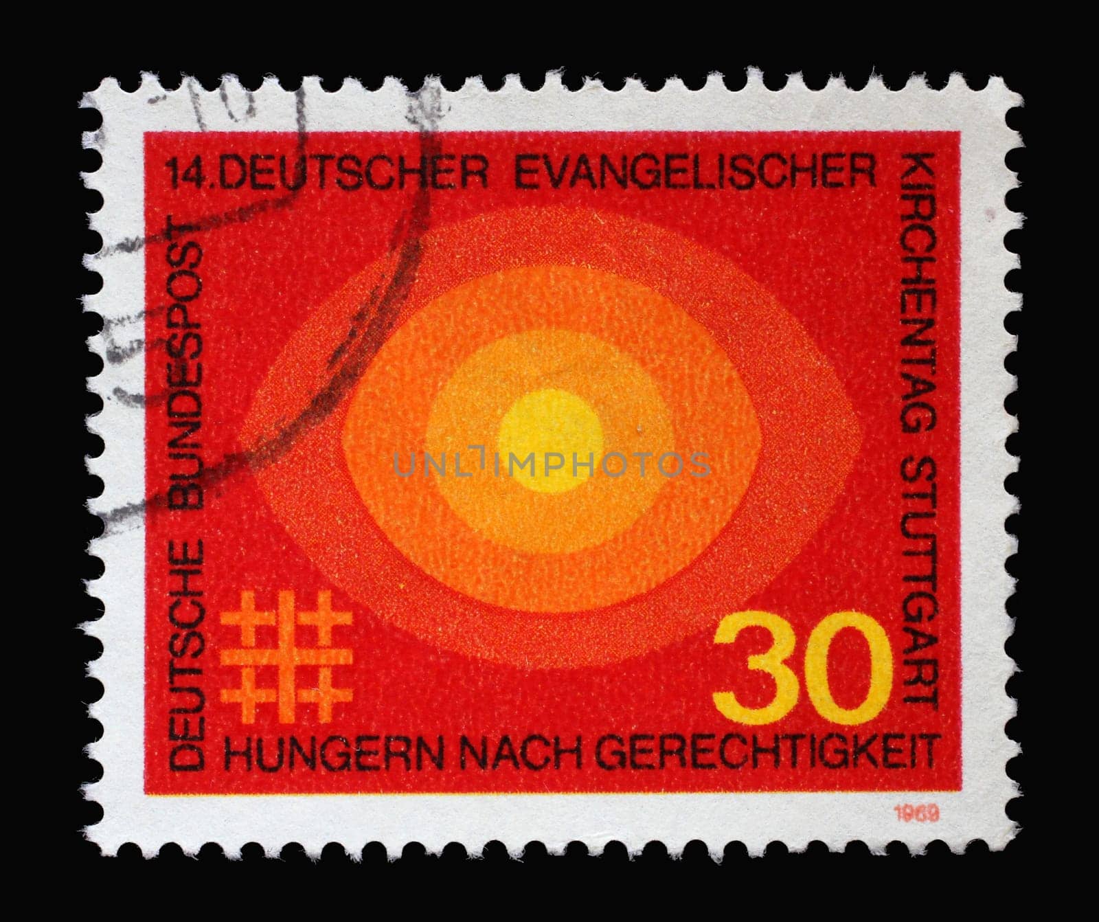Stamp printed in Germany showing several circles in orange, 4th German Evangelical church day Stuttgart, hunger for justice, circa 1969