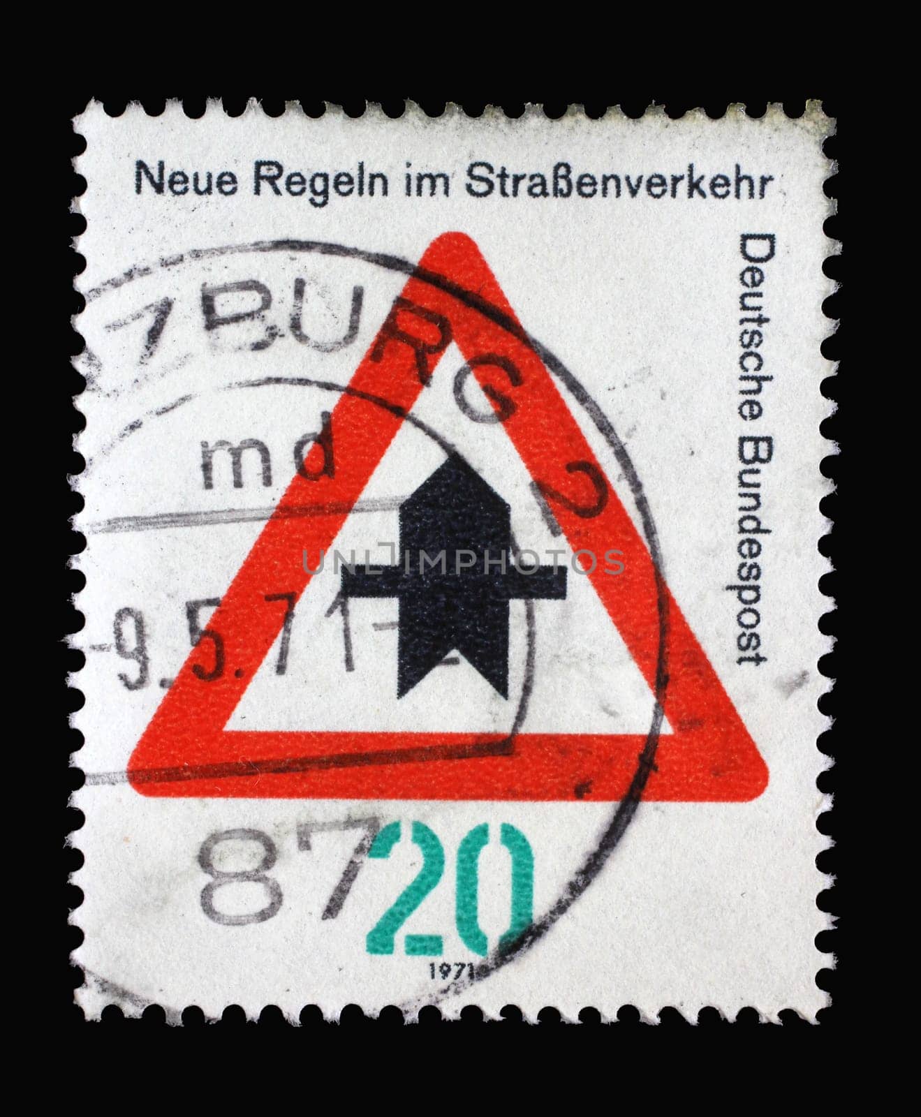 Stamp printed in Germany dedicated to New traffic rules, shows a road sign "Proceed with caution"", circa 1971"