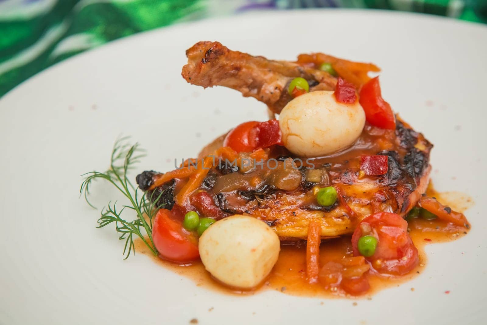 roasted chicken leg with vegetables, herbs and eggs