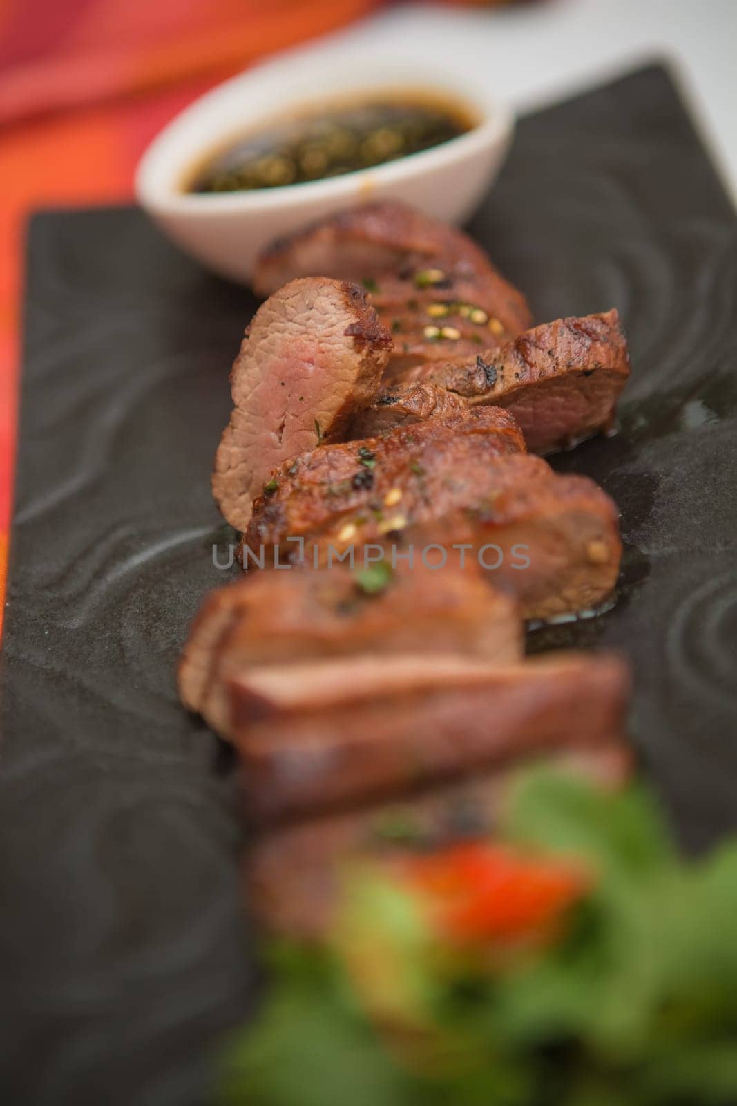 organic fresh ripe roasted beef meat with sauce on plate