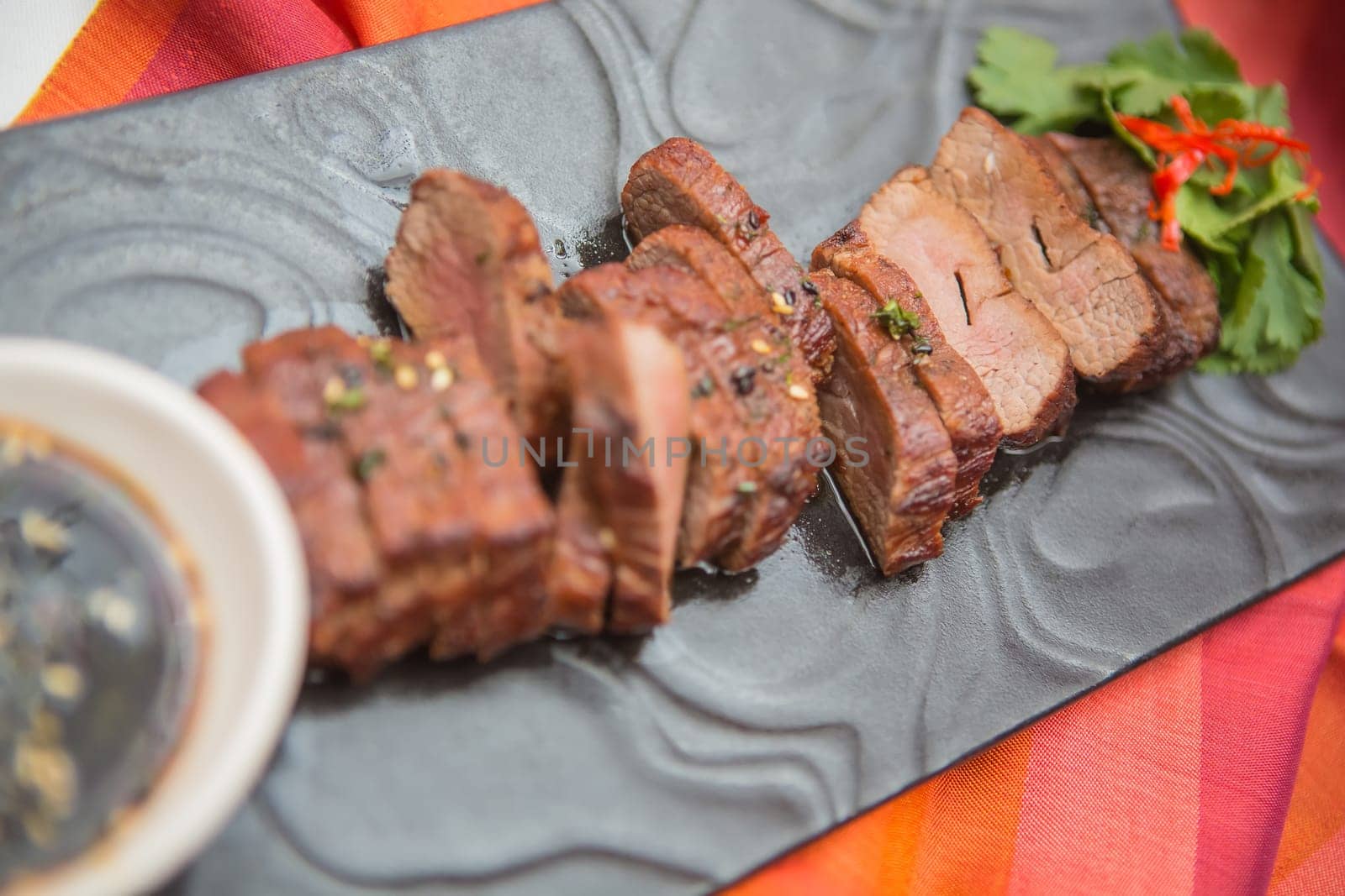 organic fresh ripe roasted beef meat with sauce on plate