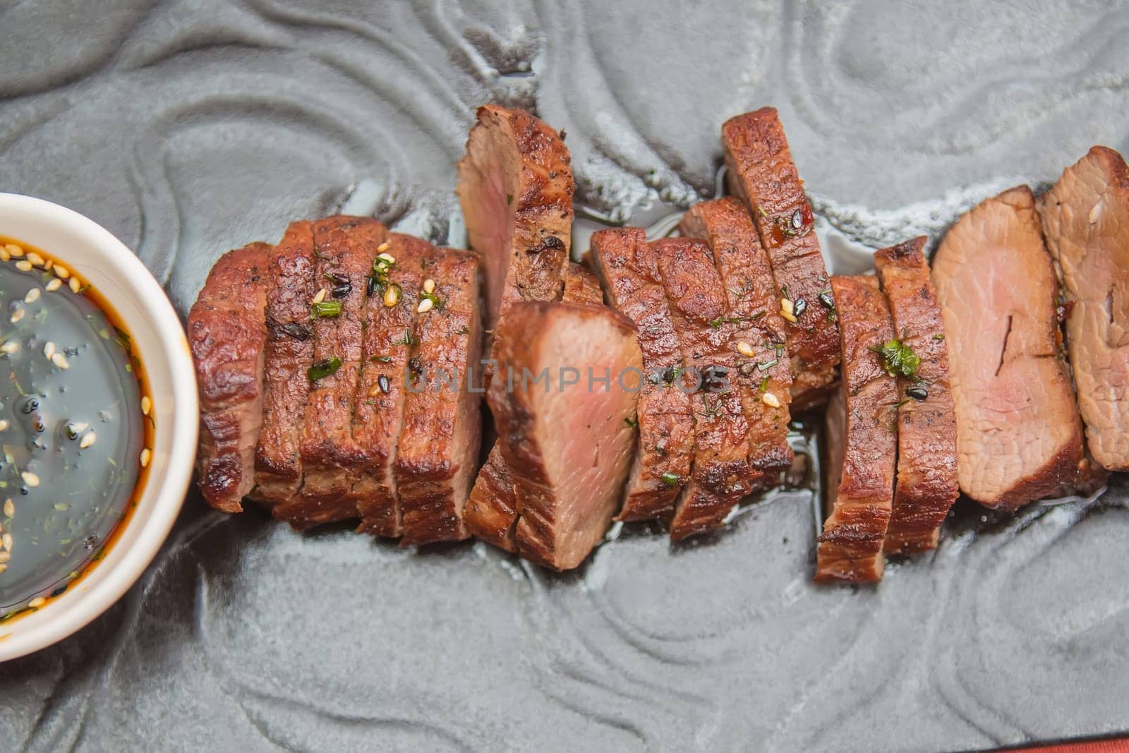 organic fresh ripe roasted beef meat with sauce on plate