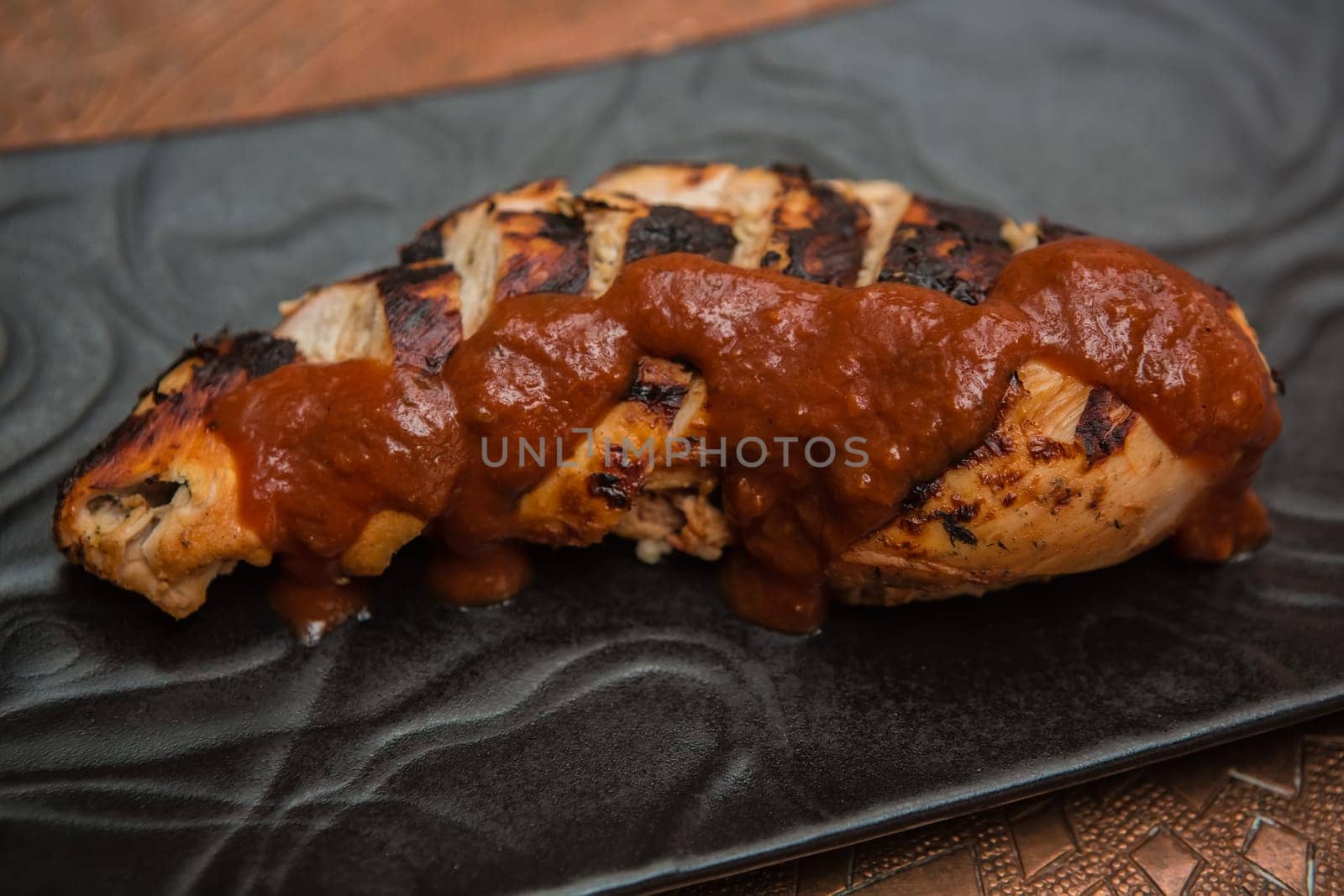 the cut chicken fillet baked in spices and tomato sauce,international kitchen