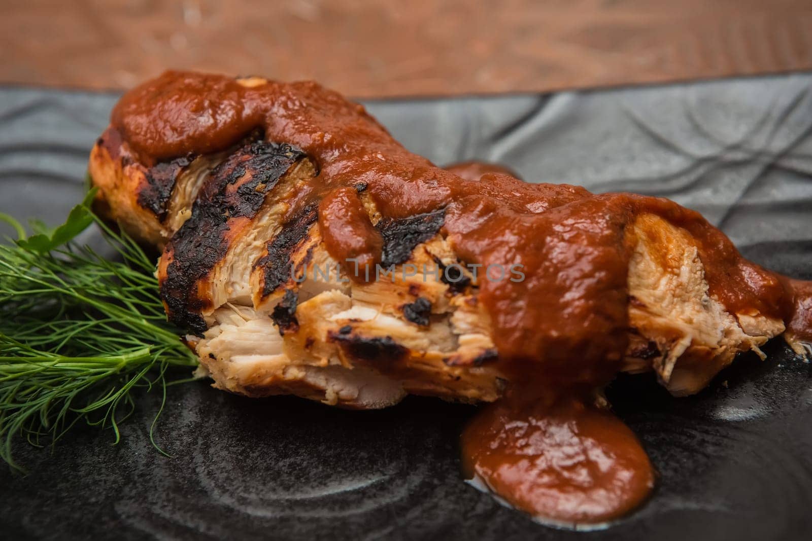 the cut chicken fillet baked in spices and tomato sauce,international kitchen