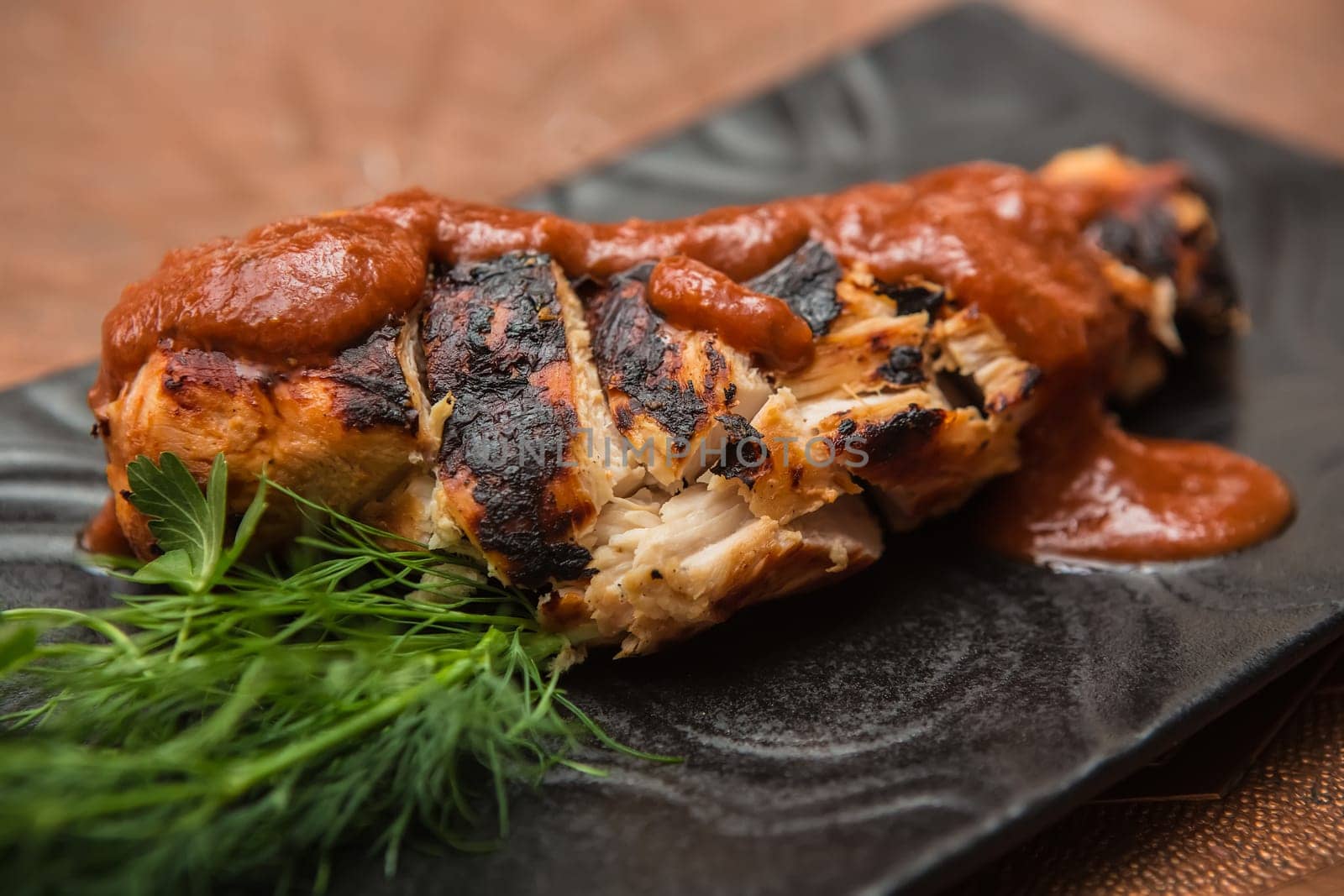 the cut chicken fillet baked in spices and tomato sauce,international kitchen