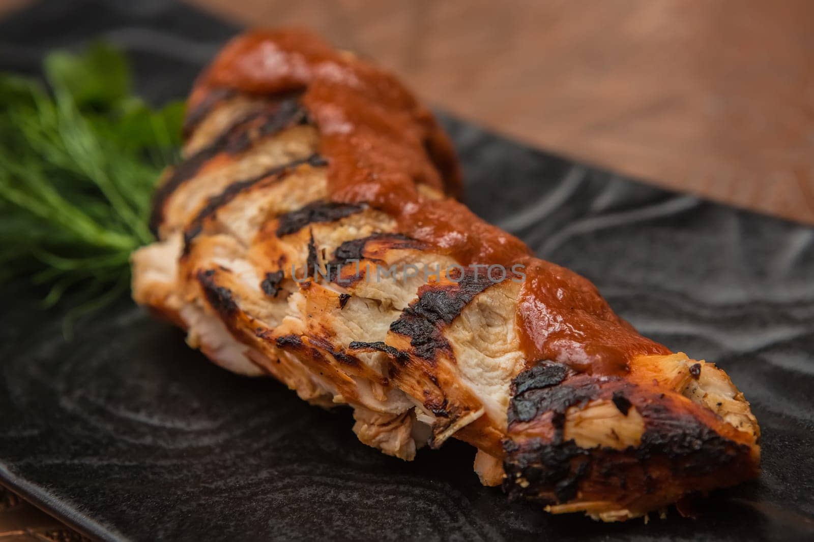 the cut chicken fillet baked in spices and tomato sauce,international kitchen