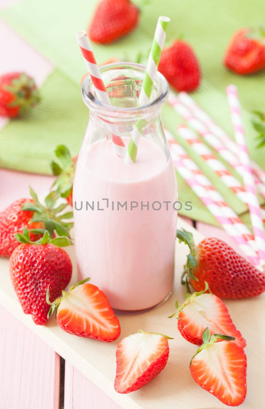 Vintage bottle of milk with fresh strawberries