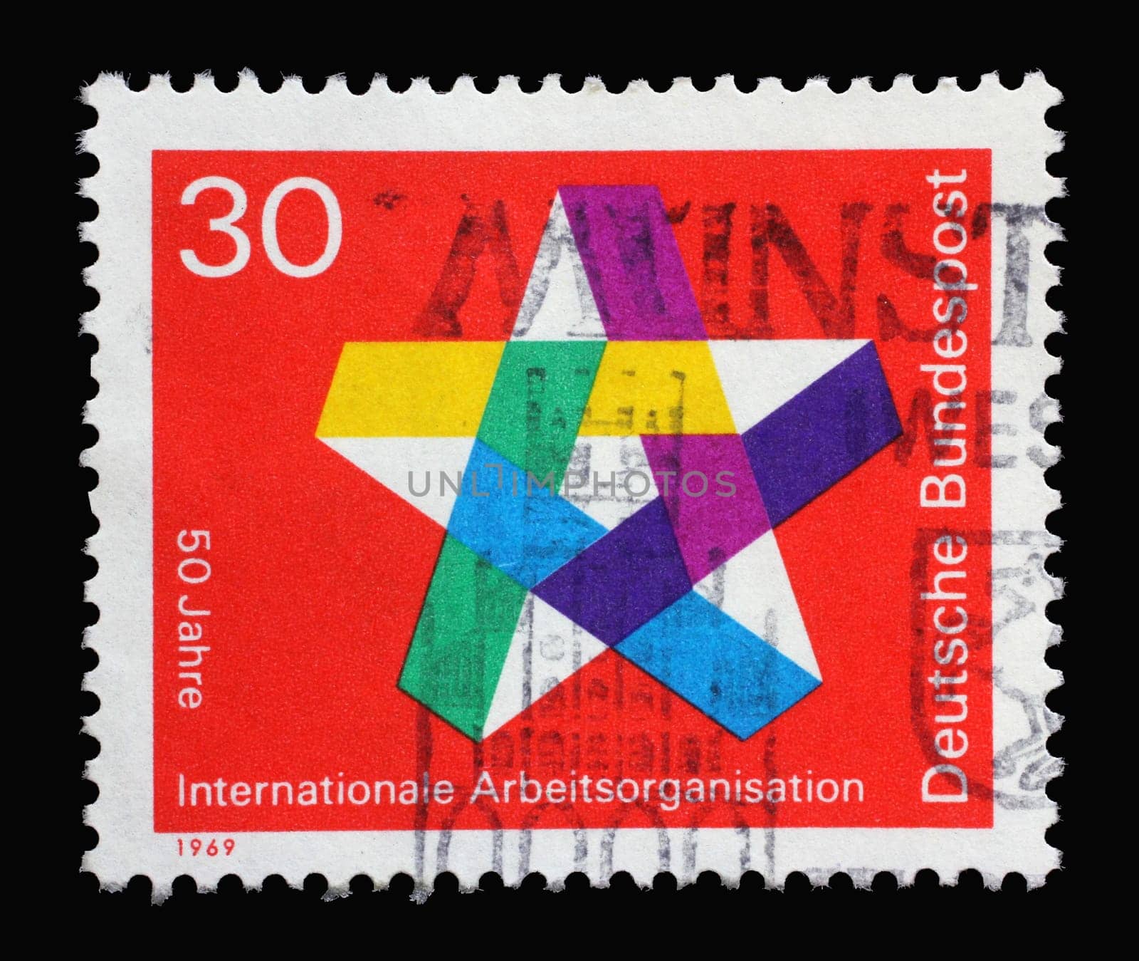 Stamp printed in Germany showing a five-pointed colorful star, 50 years of the International Labor Organization, circa 1969