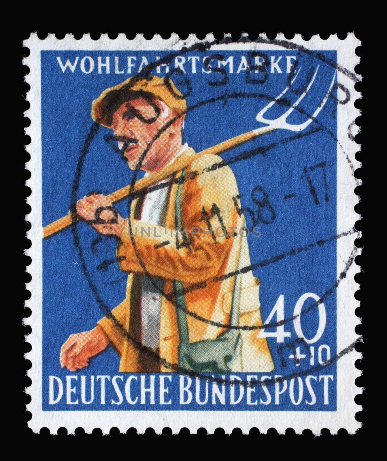 Stamp printed in Germany shows Farmer with pitchfork, circa 1958