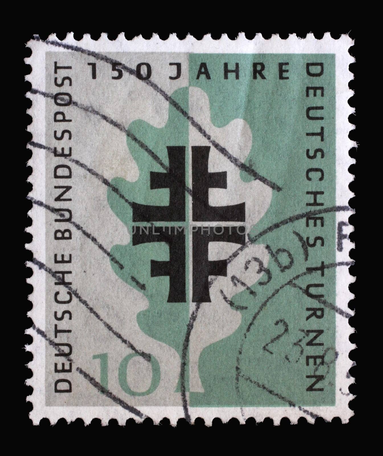 Stamp printed in Germany shows Turner Emblem and Oak Leaf, 150 years of German Turners and on the occasion of the 1958 Turner festival, circa 1958