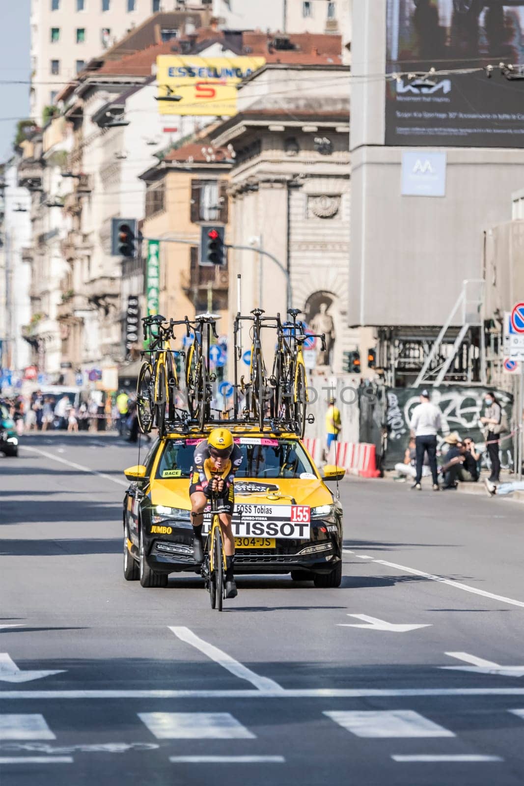 MILAN, ITALY - MAY 30: last stage of Giro 2021, Tobias Foss competitor and Jumbo-Visma Team following car at high speed during individual time trial in city streets, shot on may 30, 2021 Milan, Italy.