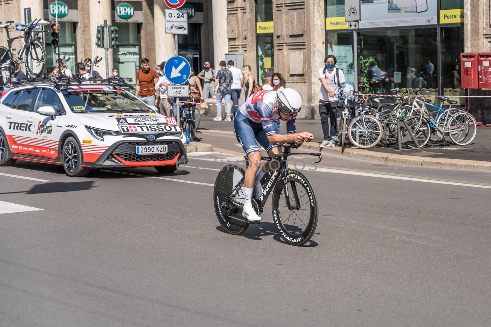 MILAN, ITALY - MAY 30: last stage of Giro 2021, Bauke Mollema competitor and TREK-Segafredo Team  following car at high speed during individual time trial in city streets, shot on may 30, 2021 Milan, Italy.