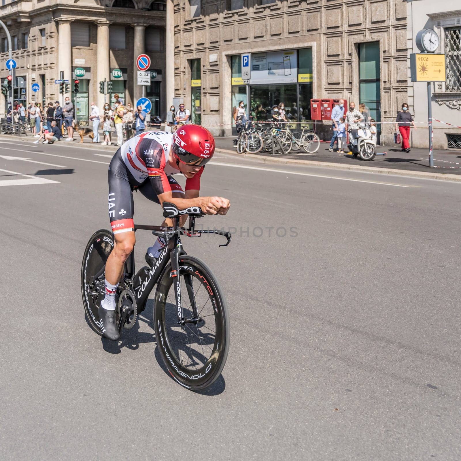 MILAN, ITALY - MAY 30: last stage of Giro 2021, Alessandro Covi competitor of UAE Emirates Team  at high speed during individual time trial in city streets, shot on may 30, 2021 Milan, Italy.