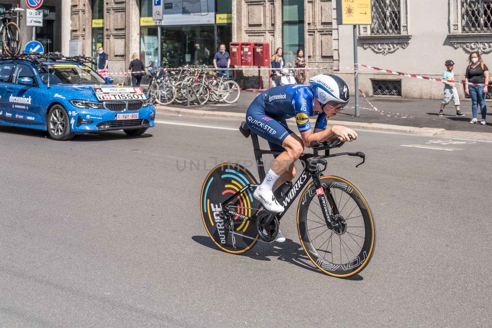MILAN, ITALY - MAY 30: last stage of Giro 2021, James Knox competitor and Quick-Step Team following car at high speed during individual time trial in city streets, shot on may 30, 2021 Milan, Italy.