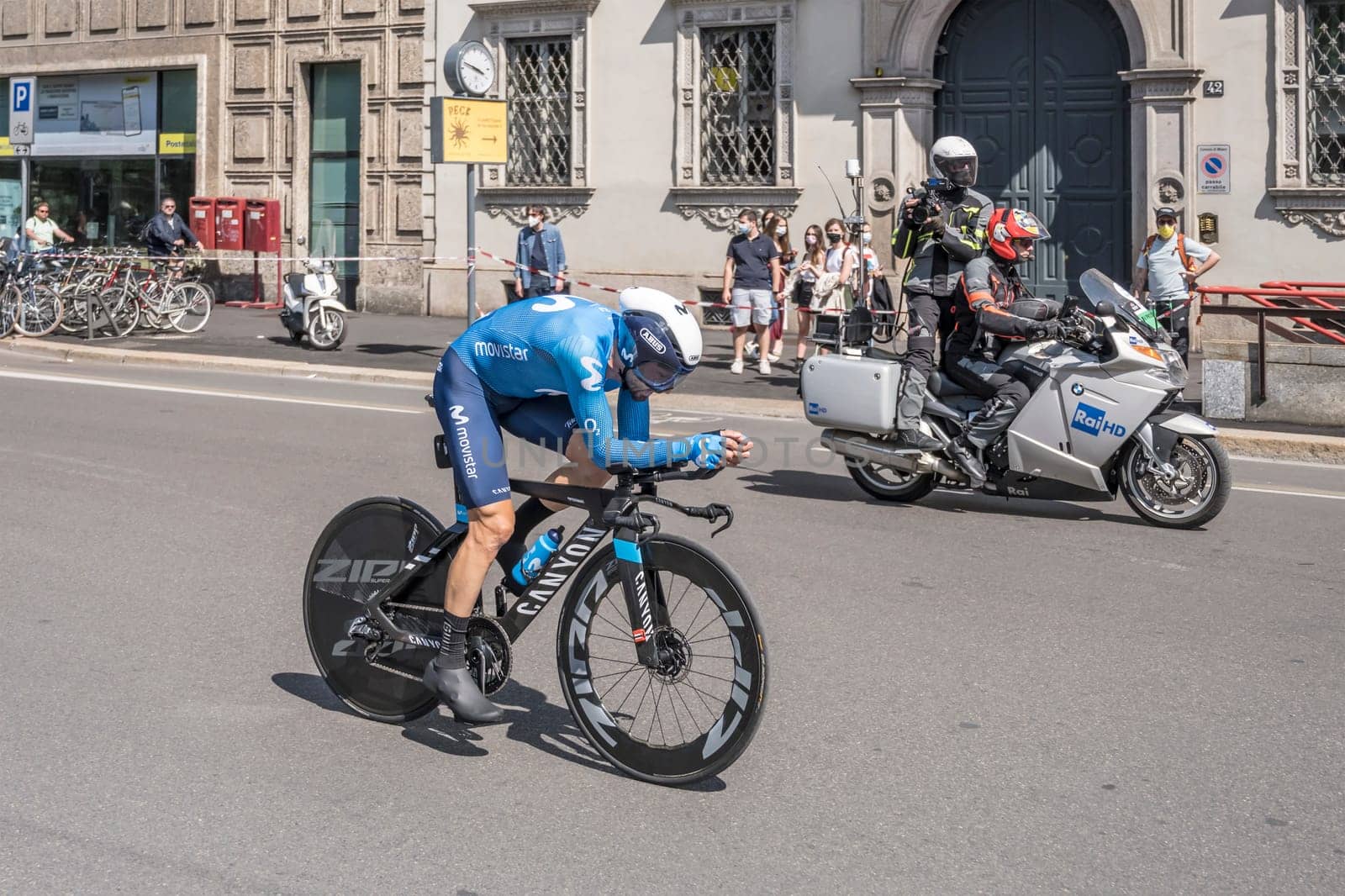 MILAN, ITALY - MAY 30: last stage of Giro 2021, Dario Cataldo competitor of Moviestar Team  at high speed during individual time trial in city streets with camera bike in background, shot on may 30, 2021 Milan, Italy.