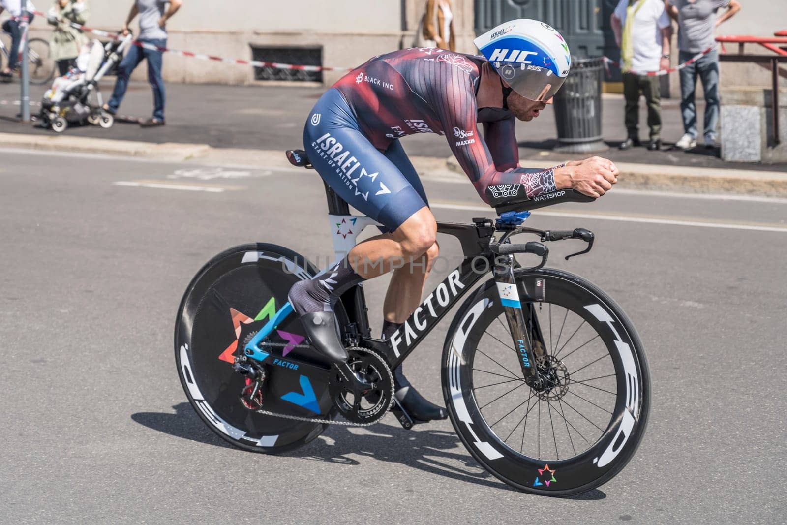 MILAN, ITALY - MAY 30: last stage of Giro 2021, Patrick Bevin competitor of Israel Start-up Nation Team at high speed during individual time trial in city streets, shot on may 30, 2021 Milan, Italy.