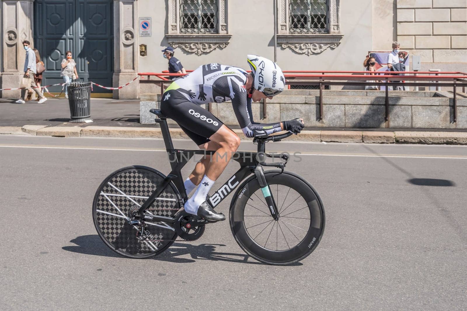 MILAN, ITALY - MAY 30: last stage of Giro 2021, Killian Frankiny competitor of Qhubeka-Assos Team  at high speed during individual time trial in city streets, shot on may 30, 2021 Milan, Italy.
