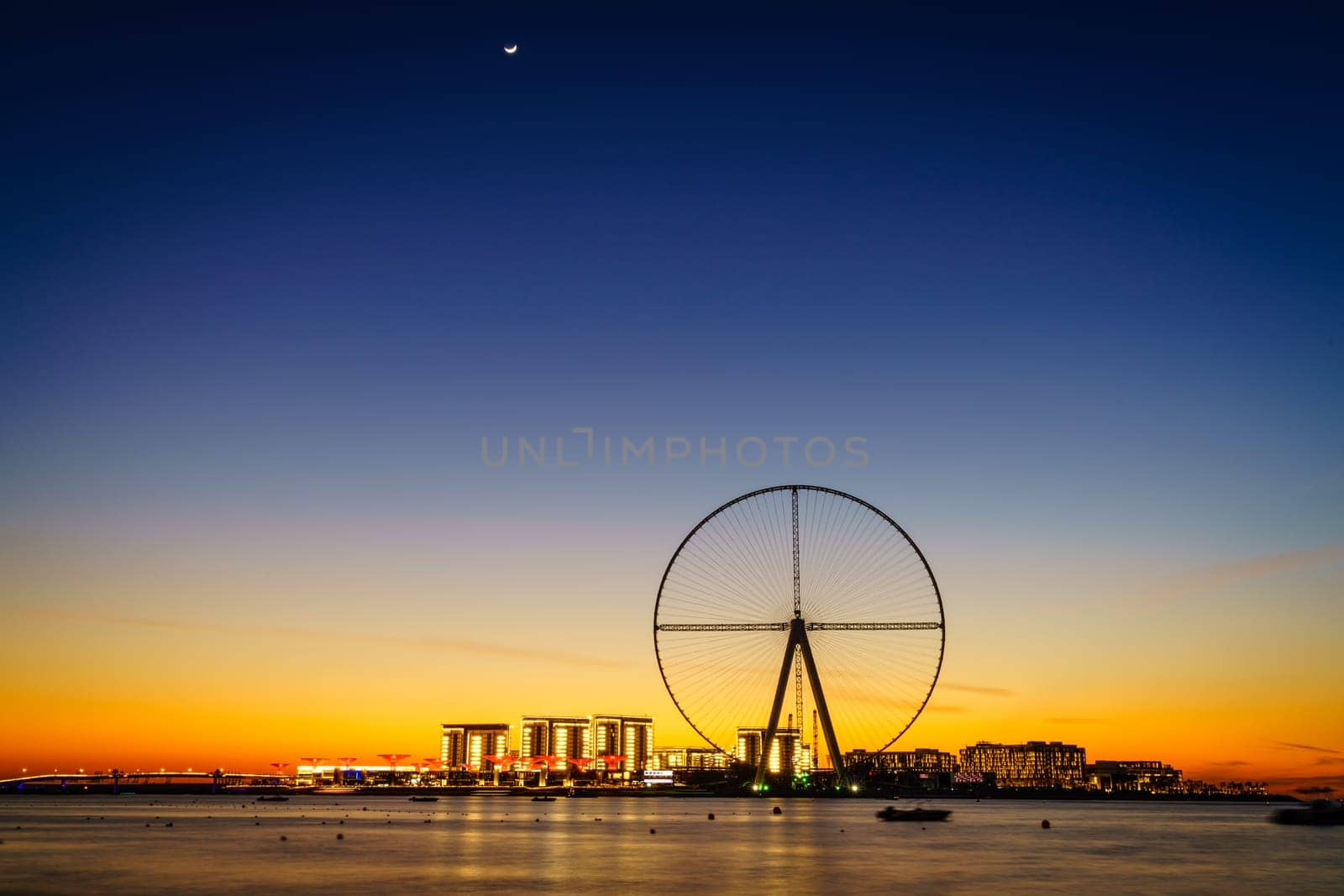 Twilight view of Bluewaters Island and Ain Dubai during construction, Dubai, UAE