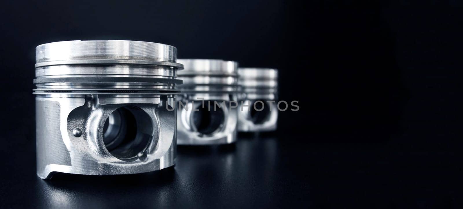 Banner of piston isolated on black background with copy space. Car service and maintenance concept.