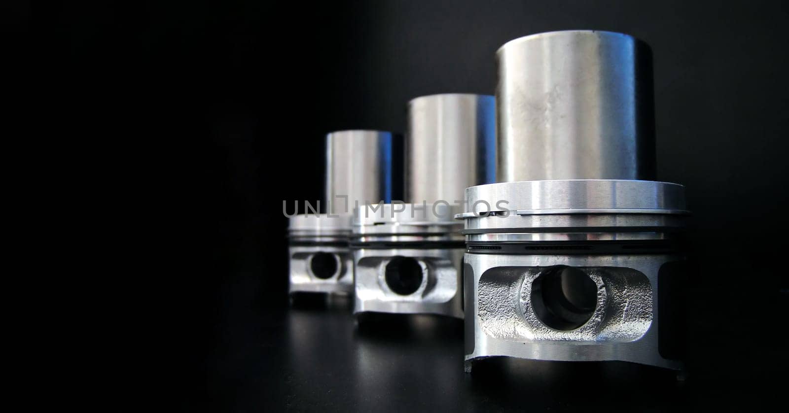 Banner of piston isolated on black background with copy space. Car service and maintenance concept.