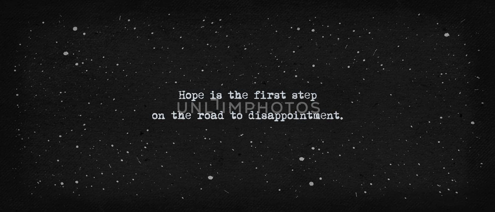 Hope is the first step on the road to disappointment. Famous quote as text art illustration. Typewriter font style over vintage paper dark background.