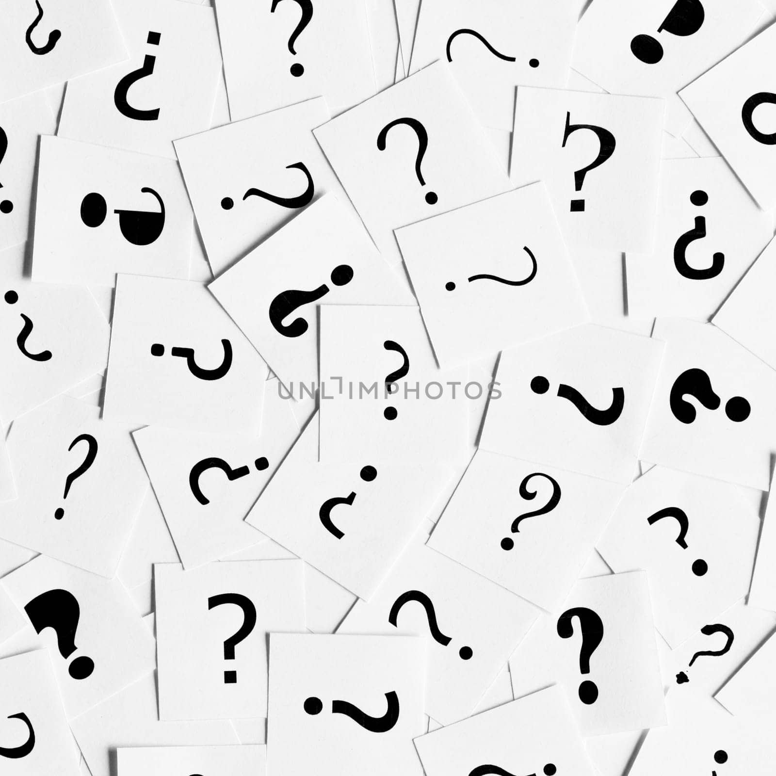 Pile of question mark signs scattered around as a square background. Decision, enquiry or faq concept.
