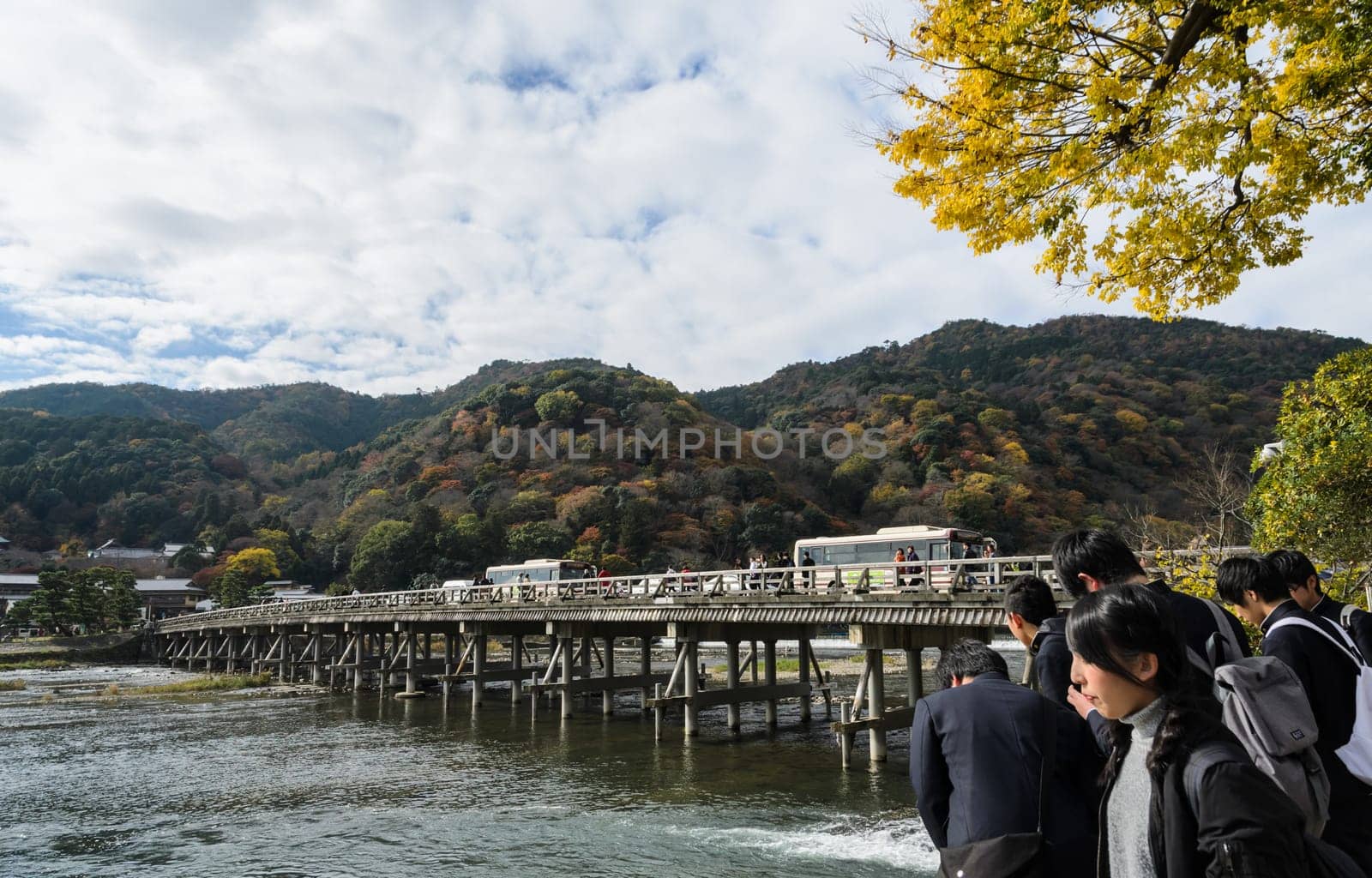 KYOTO, JAPAN -NOVEMBER 24, 2016: Togetsukyo bridge over Katsura river during autumn season in Arashiyama, Kyoto, Japan