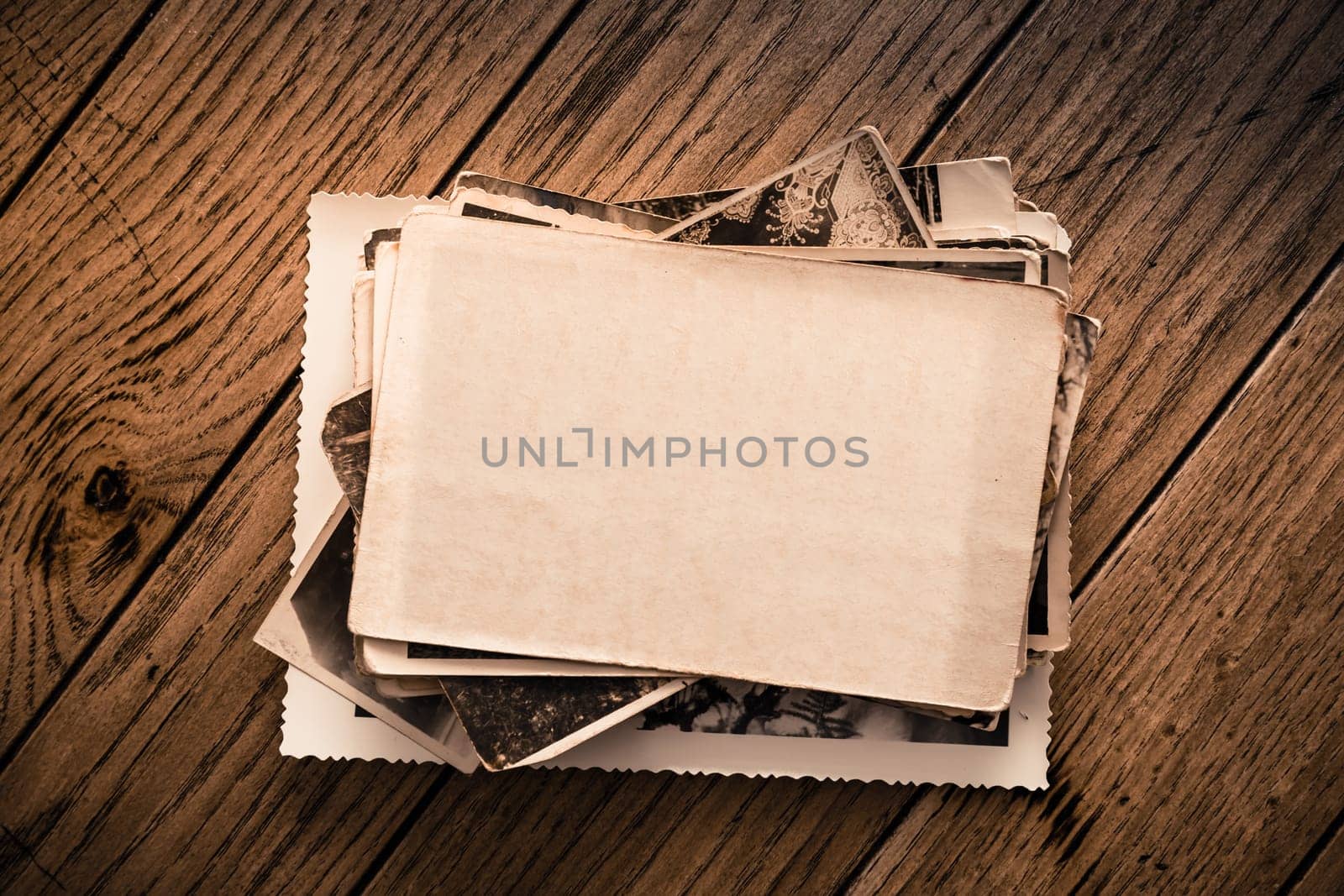 Memories - stock of old and vintage photos on wooden background with copy space