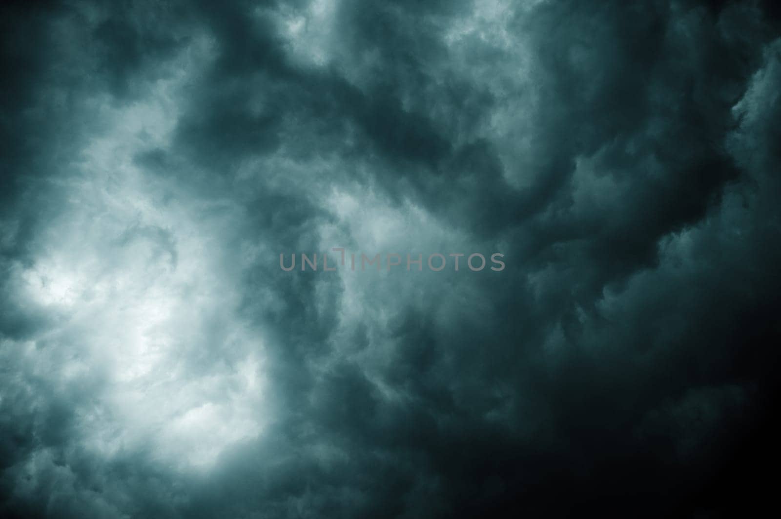 Thick dark black storm clouds covering summer sunset sky with gale-speed wind blowing just before Nor'westers Kalbaishakhi Bordoisila thunderstorm torrential rain. Atmospheric Texture background.