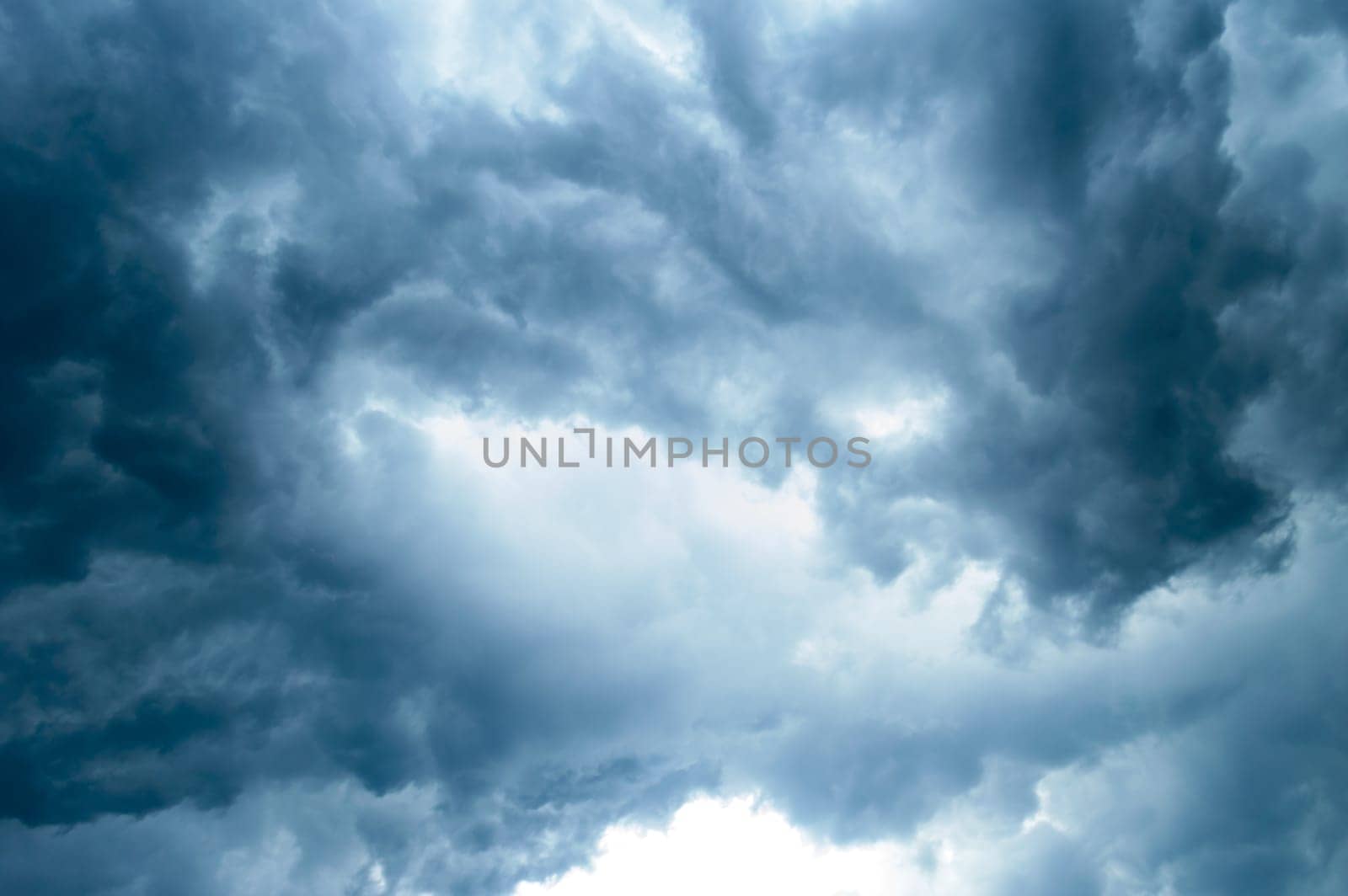 Thick dark black storm clouds covering summer sunset sky with gale-speed wind blowing just before Nor'westers Kalbaishakhi Bordoisila thunderstorm torrential rain. Atmospheric Texture background.