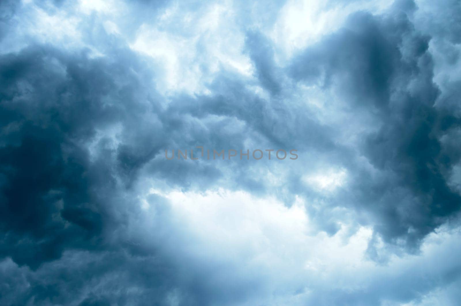 Thick dark black storm clouds covering summer sunset sky with gale-speed wind blowing just before Nor'westers Kalbaishakhi Bordoisila thunderstorm torrential rain. Atmospheric Texture background.