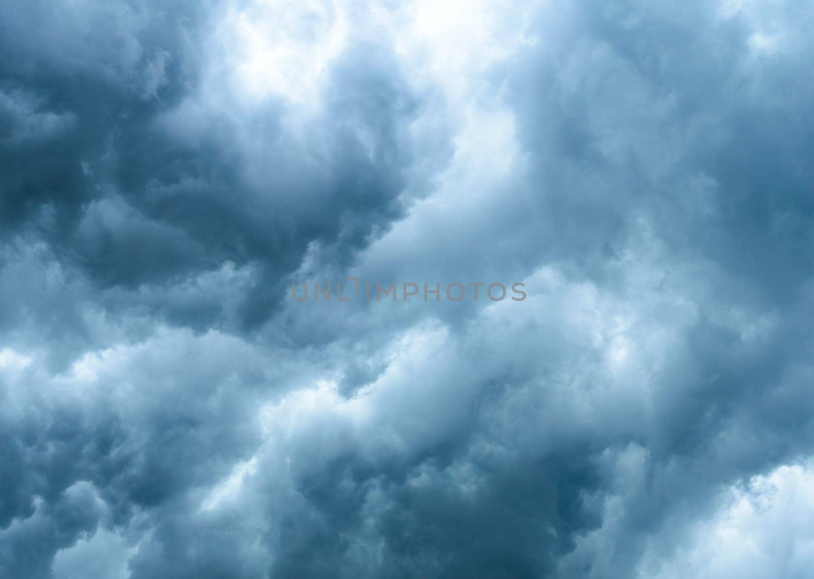 Thick dark black storm clouds covering summer sunset sky with gale-speed wind blowing just before Nor'westers Kalbaishakhi Bordoisila thunderstorm torrential rain. Atmospheric Texture background.