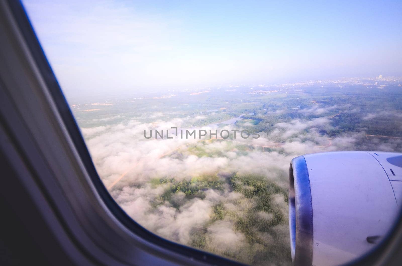 Sky view from airplane. Aerial view from windows. Transportation Concept.