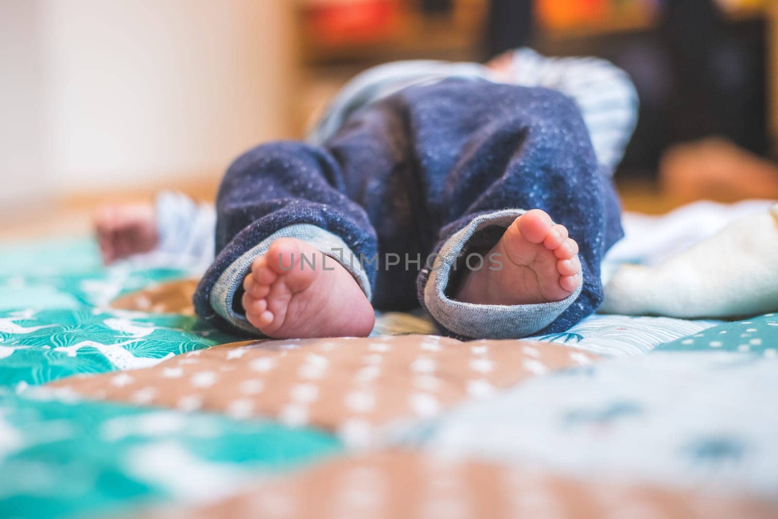 Close up of newborn baby feet on baby blanket